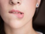 Woman bites her lips.