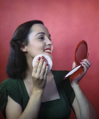 Woman Putting On Face Powder
