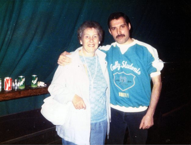 Freddie Mercury, backstage with a fan in Leiden, 1986