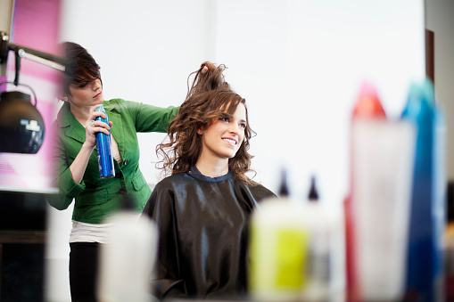 hairstylsts working at hair salon - фото
