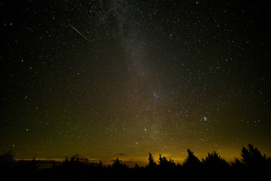 In this 30 second exposure, a meteor streaks across the sky during the annual Perseid meteor shower Friday, Aug. 12, 2016 in Spruce Knob, West Virginia. Photo Credit: (NASA/Bill Ingalls)