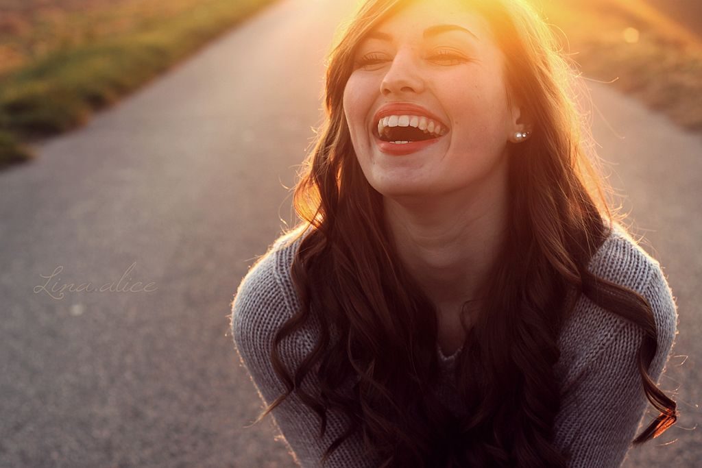 Happy girl laughing - фото