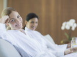 Women relaxing together in spa - фото