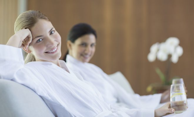Women relaxing together in spa - фото