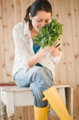 135538004-brazilian-woman-smelling-fresh-mint-gettyimages